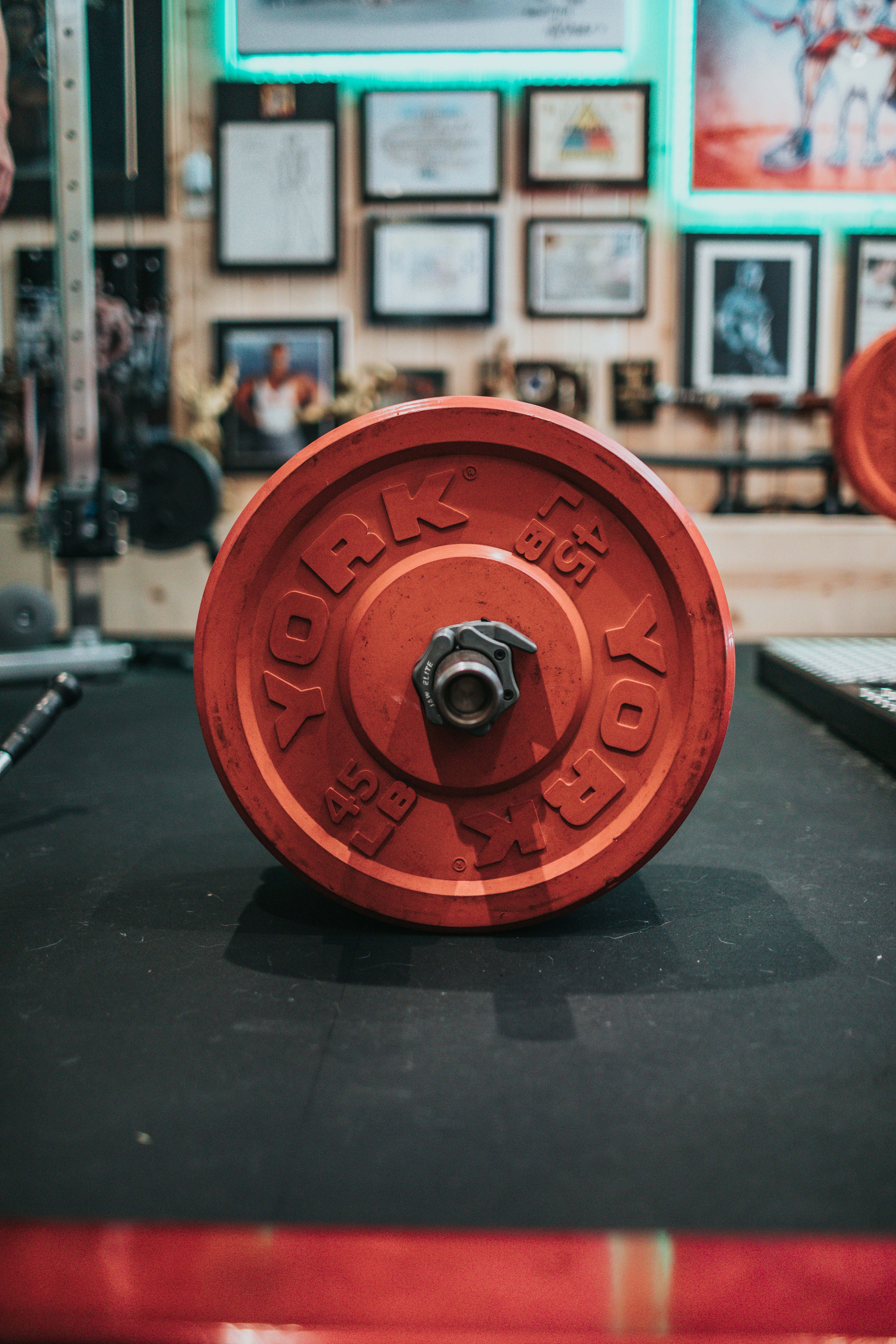 red round dumbbell on black table